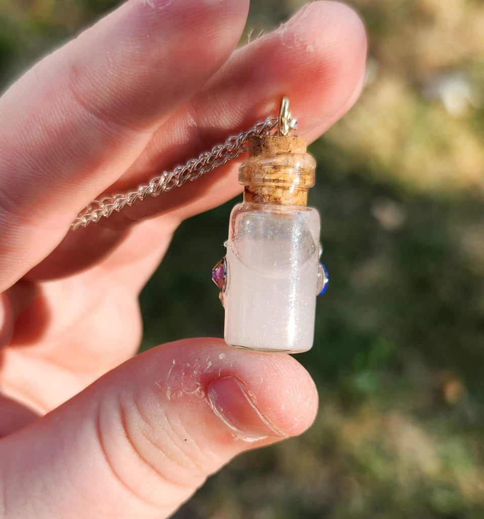 Handmade potion bottle necklace charm made of glass,... - Depop